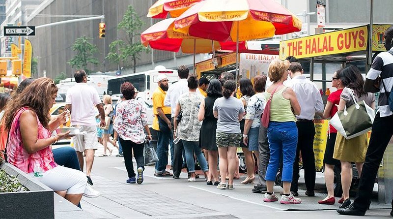 Located in Midtown Manhattan, lit up fast food-cart from the network Halal Guys