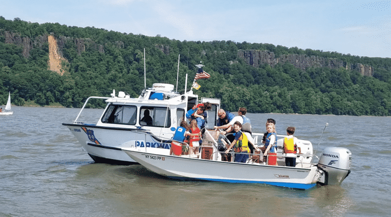 In the Hudson river capsized sailboat with 2 children