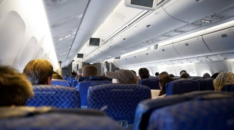 The flight attendant dropped a bottle of wine on the head unruly passenger