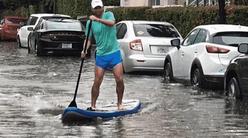 After the storm, Miami’s residents move around the streets in boats and rafts