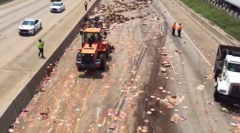 Arkansas on the road overturned truck with pizza