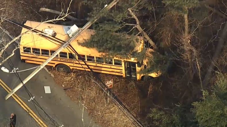 New Jersey school bus carrying children collided with a car and crashed into an electric pole