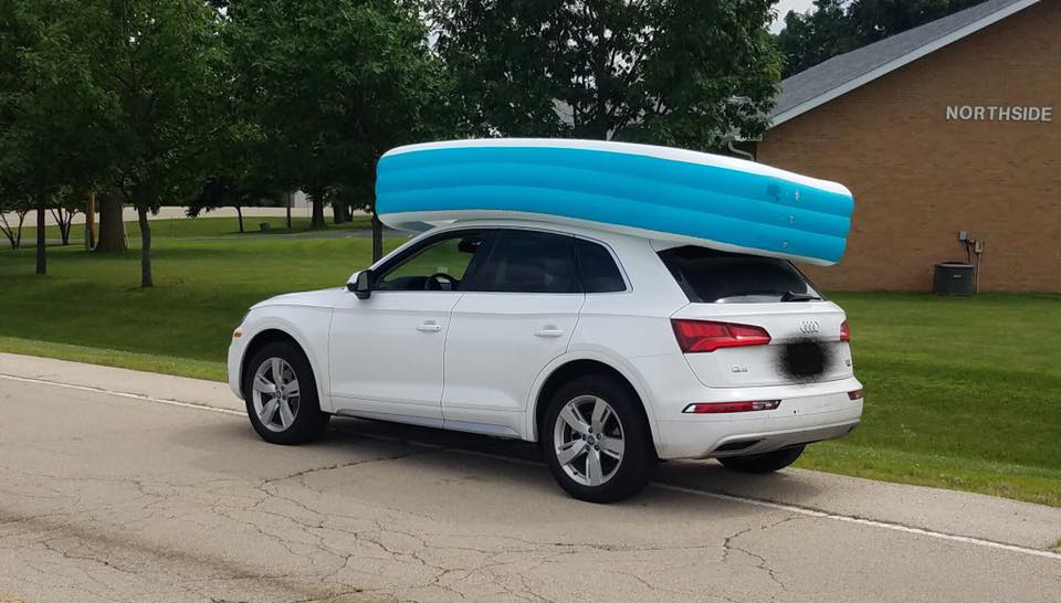 The mother was traveling with an inflatable pool on the roof of the car — and it had two children