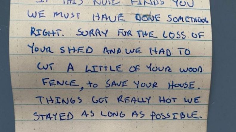 Colorado firefighters leave a note of apology after chopping down a fence to save a house from fire