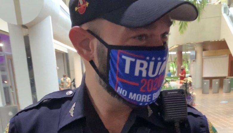Policeman wearing Trump 2020 mask accused of intimidating voters