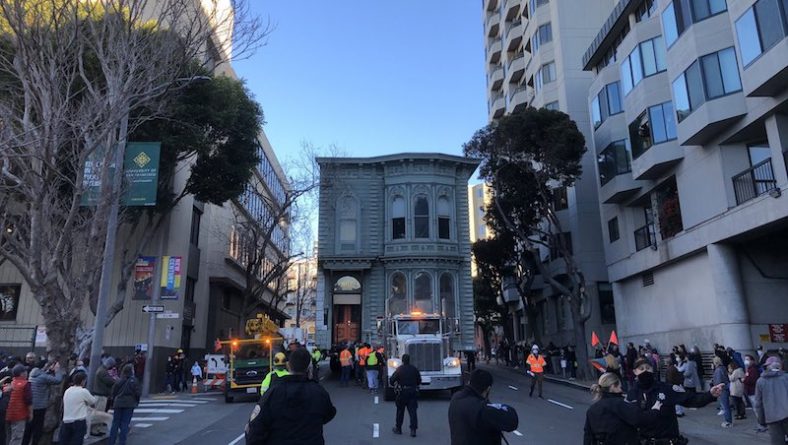 A two-story house drove through the streets of San Francisco. Moved to a new address